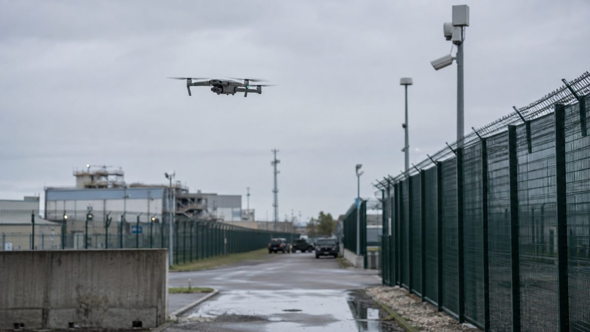 Drone flying over a secure industrial site under military surveillance in France