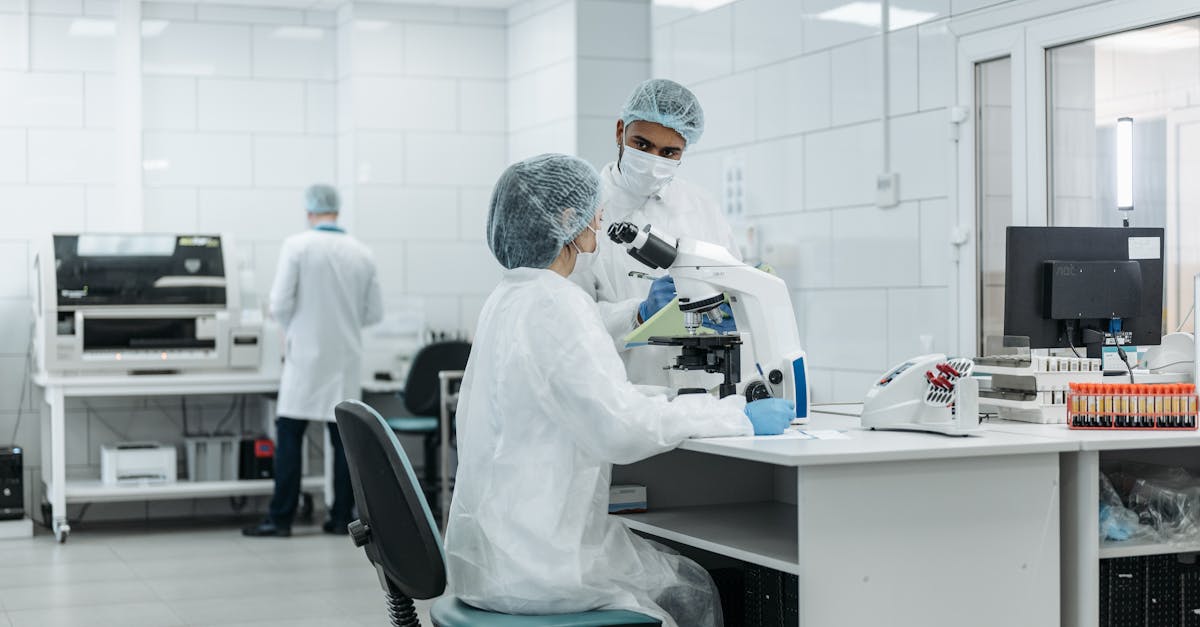 Researchers in protective suits working on Ebola virus samples in an African laboratory